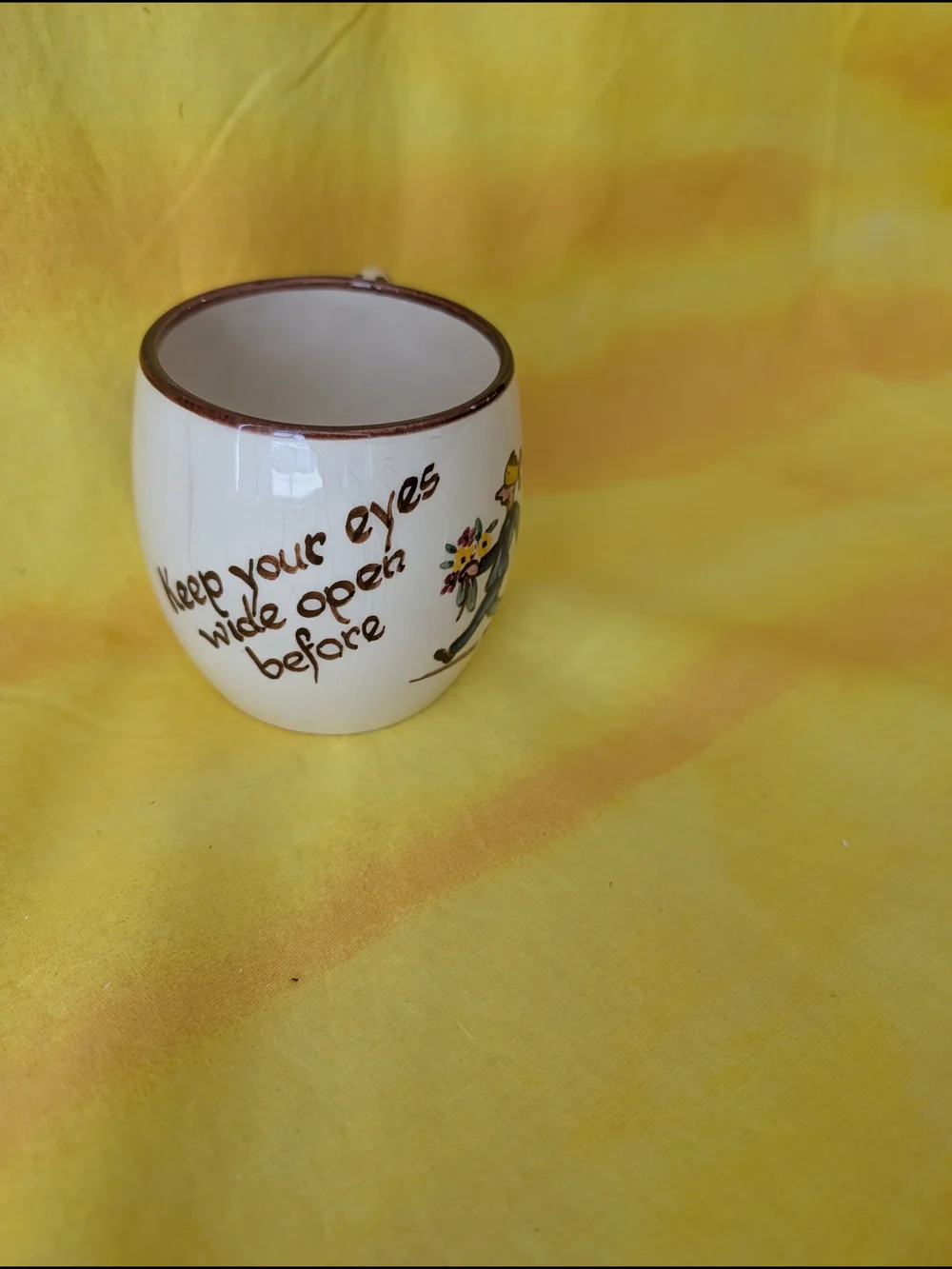 Hand-Painted Cream Ceramic Mug with Brown Trim and Colorful Illustration